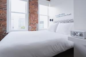 Postel nebo postele na pokoji v ubytování Hotel Hive
