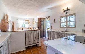 a kitchen with a sink and a counter top at Casa La Casita in Periana
