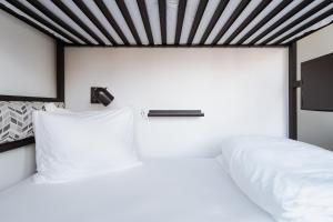 Postel nebo postele na pokoji v ubytování Hotel Hive