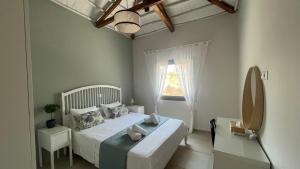A bed or beds in a room at VILLA ANTHIMOS
