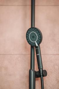 a black microphone sitting on top of a stand at ZILTer - Groot duplex appartement met terras in Ostend