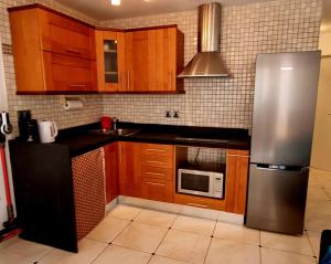 Kuchyň nebo kuchyňský kout v ubytování FUERTE DREAM Home