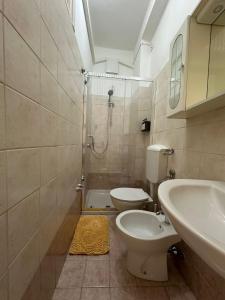 a bathroom with a sink and a toilet and a shower at CasaMirandola in Vicenza