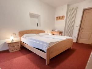 Postel nebo postele na pokoji v ubytování Albergo Al Pin