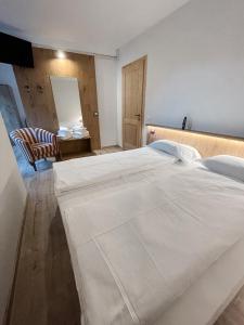 Postel nebo postele na pokoji v ubytování Albergo Al Pin