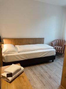 Postel nebo postele na pokoji v ubytování Albergo Al Pin