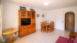 A television and/or entertainment centre at Primera línea Playa Cargador - Playamar 1021 - ALBERT VILLAS