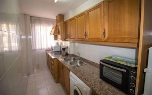 A kitchen or kitchenette at Primera línea Playa Cargador - Playamar 1021 - ALBERT VILLAS