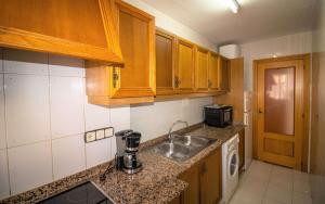 A kitchen or kitchenette at Primera línea Playa Cargador - Playamar 1021 - ALBERT VILLAS