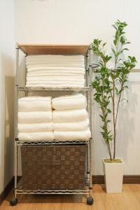 Postel nebo postele na pokoji v ubytování MOMOYA nagomi