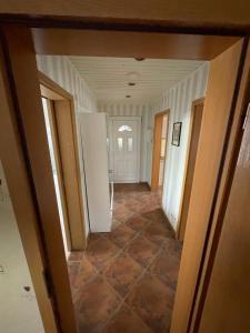 a hallway of a house with a room with a floor at Ferienwohnung in Schmölln zentrale Lage in Schmölln