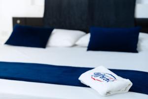 Postel nebo postele na pokoji v ubytování Hotel Urak