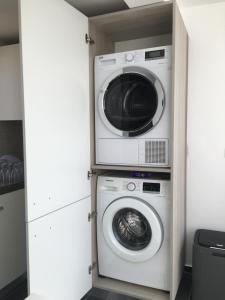 a washer and dryer in a small room at Nemy Sliema Guesthouse in Sliema