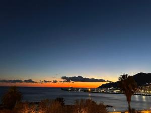 a view of the ocean at sunset at Plaza Apartment in Salerno