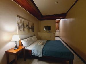 Postel nebo postele na pokoji v ubytování Alegria Hotel