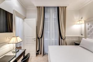 Voodi või voodid majutusasutuse ACA Hotel Viminale toas