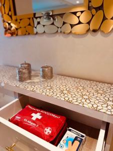 a drawer with a red box on a shelf at Modern Comfort with Moroccan Soul in Casablanca