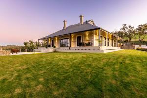 a house with a large lawn in front of it at Gawler Park Estate in Angaston