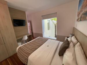 Postel nebo postele na pokoji v ubytování Casa Hotel Boyaca Real + 37 fotografií