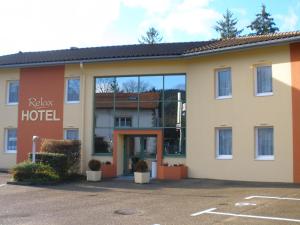 a hotel with the front of the building at Relax Hotel in Maillat