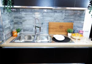 a kitchen with a sink and a counter top at Esmeralda Holiday Home in Bracciano