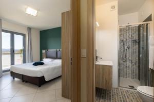 Koupelna v ubytování Tuscasì Aparthotel