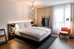 Postel nebo postele na pokoji v ubytování pentahotel Wiesbaden + 52 fotografií