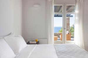 Posteľ alebo postele v izbe v ubytovaní AGL Luxury Villas + 37 fotografií