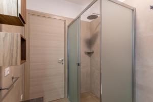 a shower with a glass door in a bathroom at Hotel Nevada in Bellaria-Igea Marina +76 photos