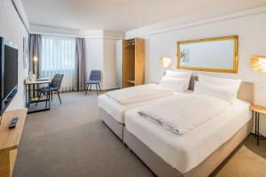 Postel nebo postele na pokoji v ubytování Best Western Hotel Mainz