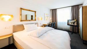 Postel nebo postele na pokoji v ubytování Best Western Hotel Mainz
