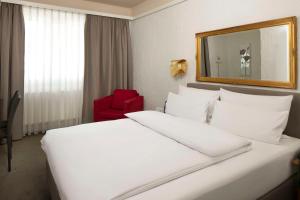 Postel nebo postele na pokoji v ubytování Best Western Hotel Mainz