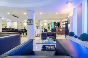 a lobby with a waiting room with chairs and a table at Best Western Plus Grand Hotel Victor Hugo in Luxembourg