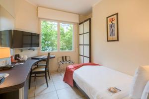Letto o letti in una camera di Best Western Plus Grand Hotel Victor Hugo