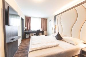 Postel nebo postele na pokoji v ubytování Best Western PLAZA Hotel Grevenbroich