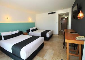 Voodi või voodid majutusasutuse Rivoli Select Hotel toas