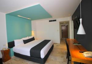 Voodi või voodid majutusasutuse Rivoli Select Hotel toas