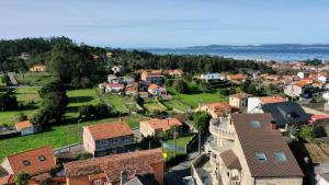 an aerial view of a small town with houses at Apartamento Casa Norte in O Grove