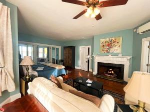 a living room with a couch and a fireplace at Saltair Inn Waterfront B&B in Bar Harbor
