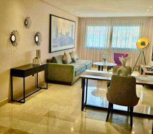a living room with a couch and a table at AS Premium By Soho Hotels Maarif in Casablanca