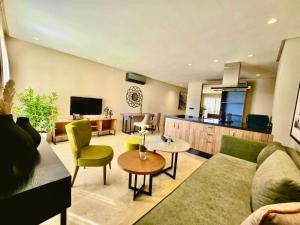 a living room with a couch and a table at AS Premium By Soho Hotels Maarif in Casablanca +103 photos