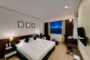 Кровать или кровати в номере Comfort Inn Sunset