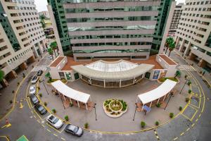 an aerial view of a building in a city at Apto no Brasil 21 - Conforto e Localizacao Central in Brasilia