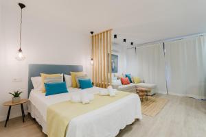 Ein Bett oder Betten in einem Zimmer der Unterkunft Rental Holidays Apartment