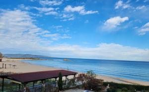 a view of a beach with a building and the ocean at Apart-Hotel Argo in Lozenets