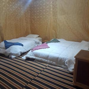 Postel nebo postele na pokoji v ubytování RestCamp ErgChebbi
