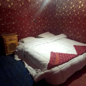 Postel nebo postele na pokoji v ubytování RestCamp ErgChebbi