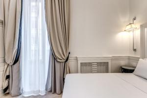 Voodi või voodid majutusasutuse ACA Hotel Viminale toas