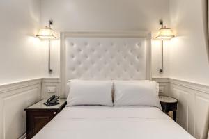 Voodi või voodid majutusasutuse ACA Hotel Viminale toas