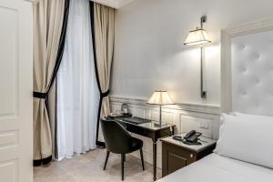 Voodi või voodid majutusasutuse ACA Hotel Viminale toas